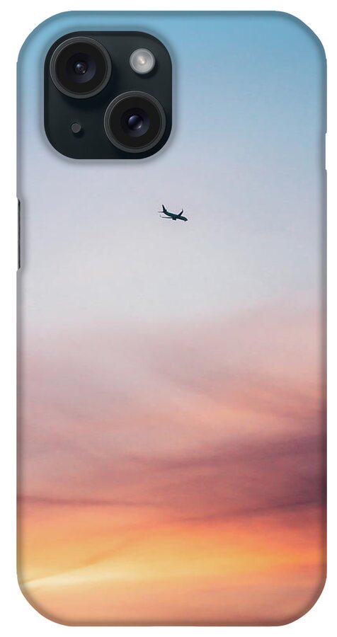 Tranquility iPhone Case featuring the photograph Airplane Flying Against Colorful Sunset by Miragec