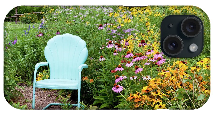 Photography iPhone Case featuring the photograph Blue Chair And Various Flowers by Panoramic Images