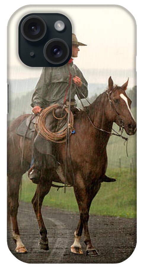 Cowboy iPhone Case featuring the photograph Braving the Rain by Todd Klassy
