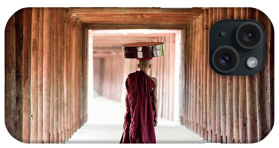 Adolescence iPhone Case featuring the photograph Buddhist Monk Walking Along Temple by Martin Puddy