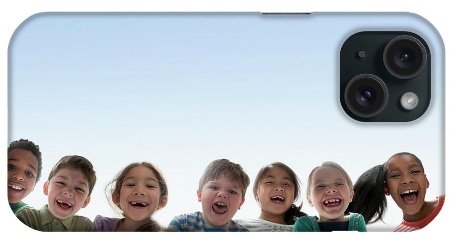 Asian And Indian Ethnicities iPhone Case featuring the photograph Children Smiling Together Outdoors by Jose Luis Pelaez Inc