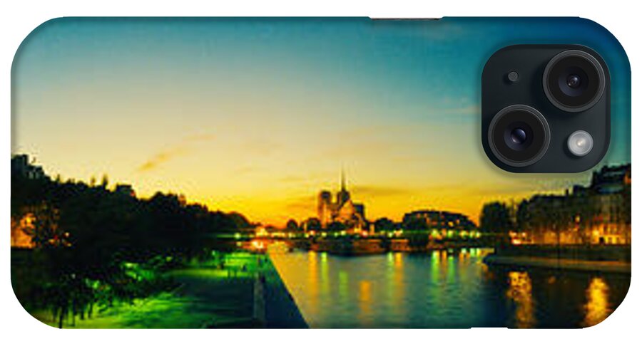 Photography iPhone Case featuring the photograph City Lit Up At Dusk, Notre Dame, Paris by Panoramic Images
