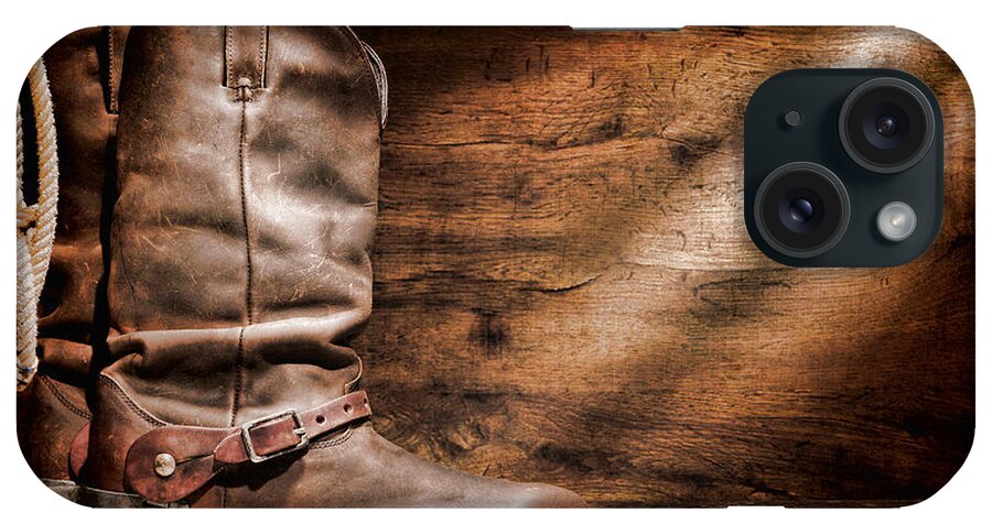 Cowboy Boots iPhone Case featuring the photograph Cowboy Boots on Wood Floor by Olivier Le Queinec