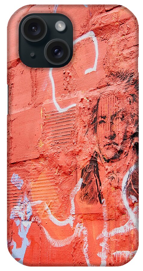 Etched Man On A Red Brick Wall iPhone Case featuring the photograph Etched man on a red brick wall by Jim Lepard