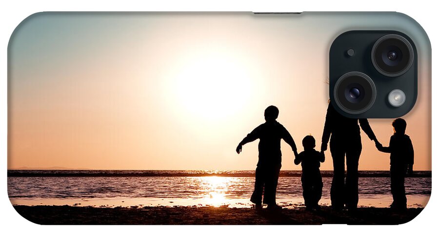 Silhouette iPhone Case featuring the photograph Family Watching Sunset by Cindy Singleton