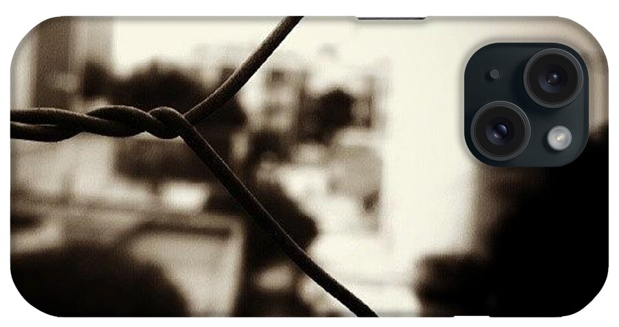 Urban iPhone Case featuring the photograph #fence #wire #freedom #urban #macro by Joe Giampaoli