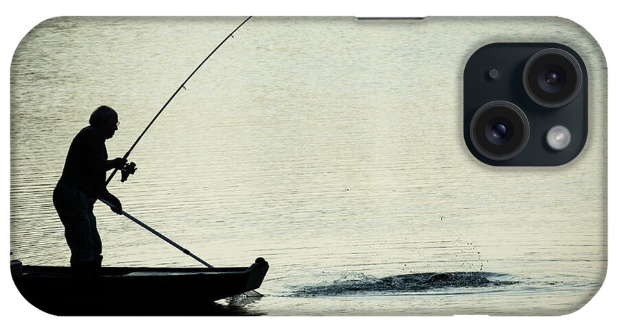 Fisher iPhone Case featuring the photograph Fisherman Catching Fish On A Twilight Lake by Andreas Berthold