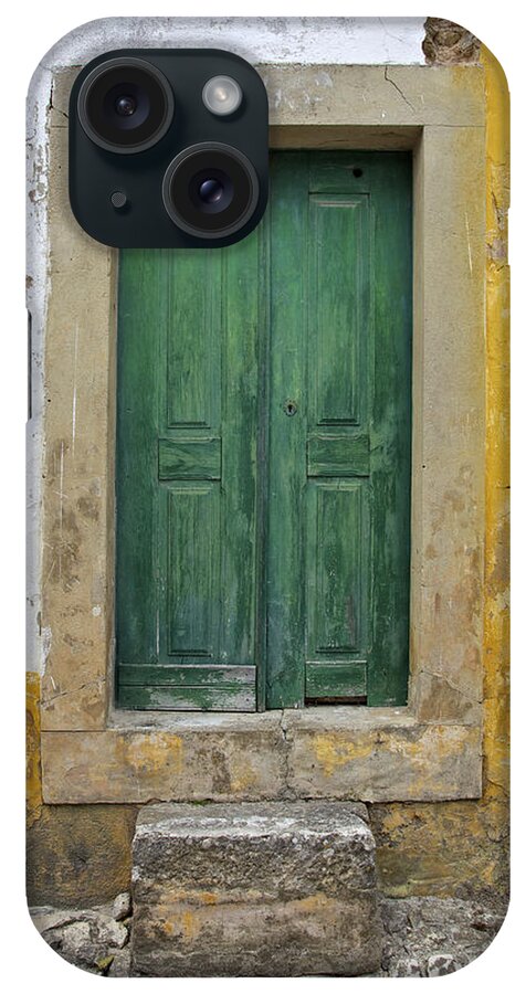 Art iPhone Case featuring the photograph Green Wood Door with Hand Carved Stone against a Texured Wall in the Medieval Village Of Obidos by David Letts