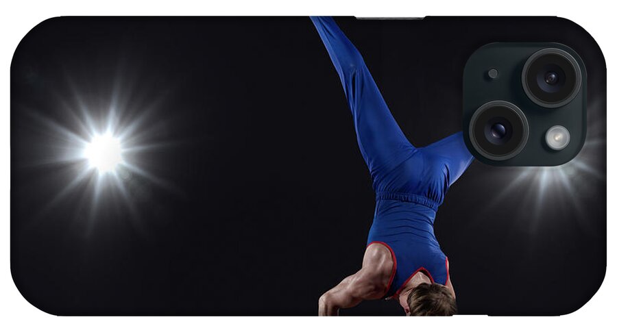 Focus iPhone Case featuring the photograph Male Gymnast Doing Handstand On Pommel by Mike Harrington