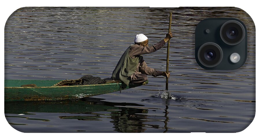 Beautiful Scene iPhone Case featuring the photograph Man plying a wooden boat on the Dal Lake by Ashish Agarwal