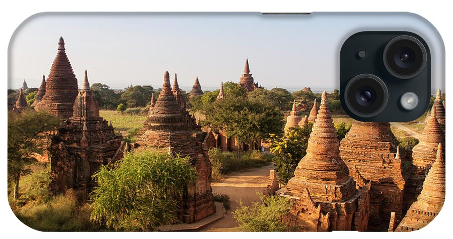 Outdoors iPhone Case featuring the photograph Myanmar Bagan Temple Array Bisected By by Alantobey