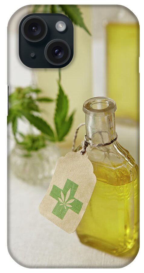 Social Issues iPhone Case featuring the photograph Oil Infused With Marijuana by Lew Robertson