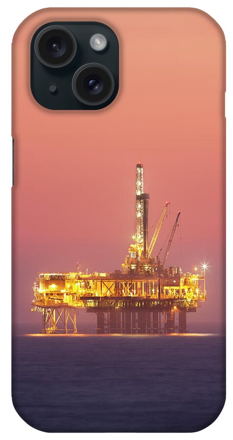 Orange Color iPhone Case featuring the photograph Oil Rig Platform In Twilight by Jimkruger