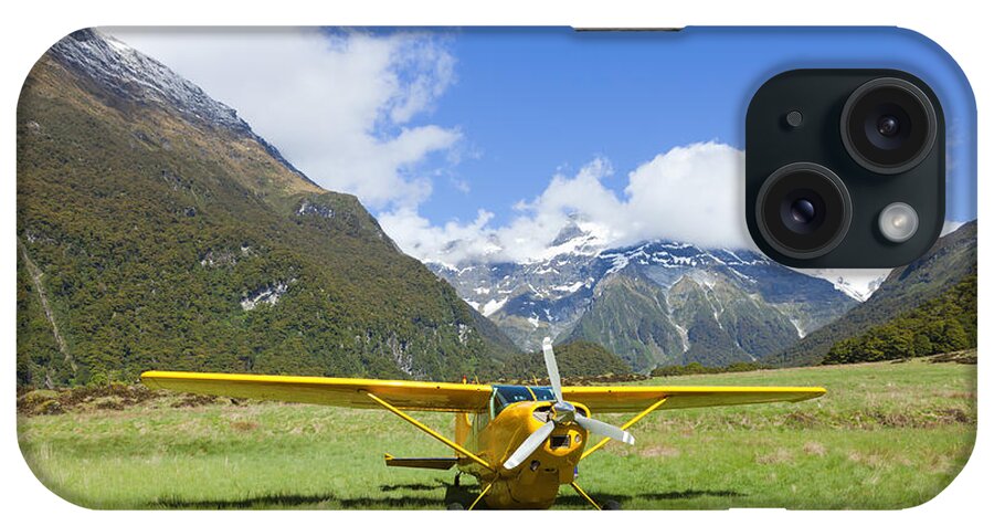 Valley iPhone Case featuring the photograph Plane in the Valley by Alexey Stiop
