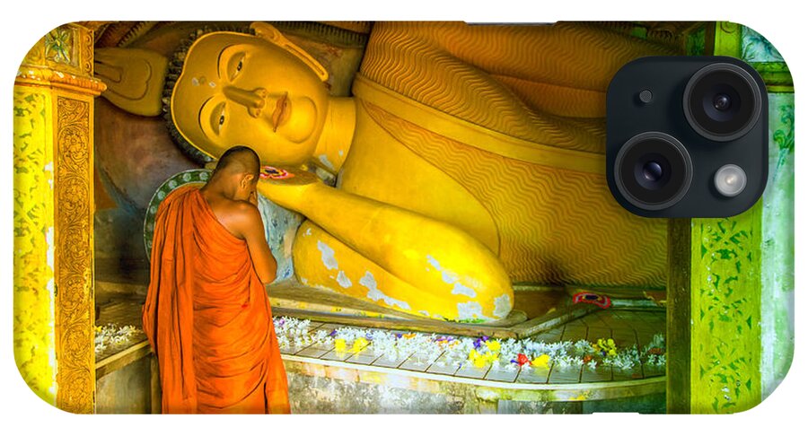 Temple iPhone Case featuring the photograph praying buddhist monk by a lying buddha in Sri Lanka by Gina Koch