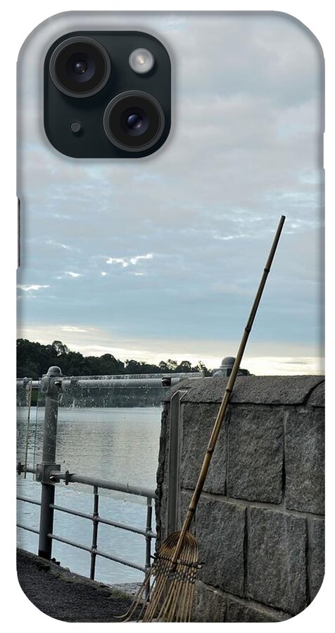 Rake iPhone Case featuring the photograph Rake rests itself after a hard days work by Imran Ahmed