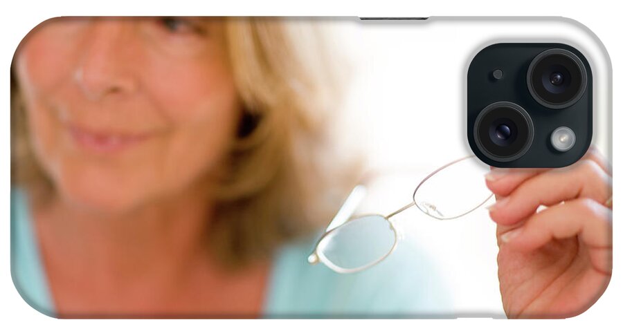 Human iPhone Case featuring the photograph Reading Glasses by Ian Hooton/science Photo Library