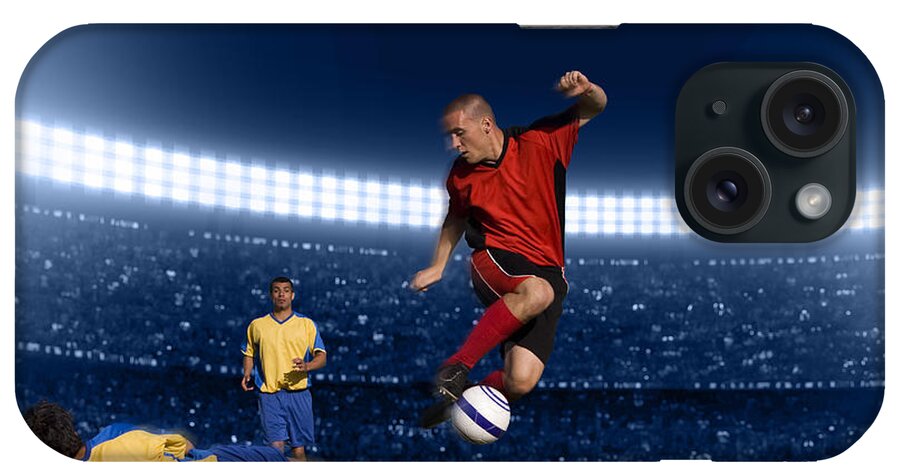 Expertise iPhone Case featuring the photograph Soccer Player Jumping With Ball by Kycstudio