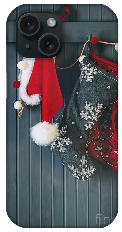Christmas iPhone Case featuring the photograph Stockings hanging on hooks for the holidays by Sandra Cunningham