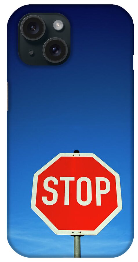 Clear Sky iPhone Case featuring the photograph Stop Sign And Blue Sky by Thomas Winz