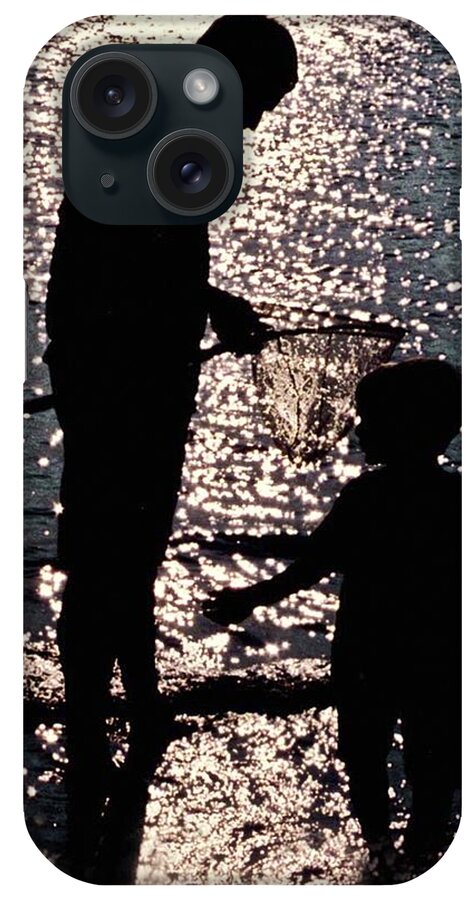 Father And Son . Silhouettes Against Sundown iPhone Case featuring the photograph Treasure by Edward Shmunes
