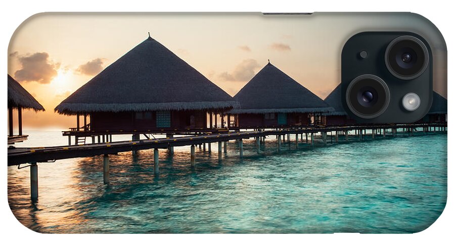 Amazing iPhone Case featuring the photograph Waterbungalows At Sunset by Hannes Cmarits