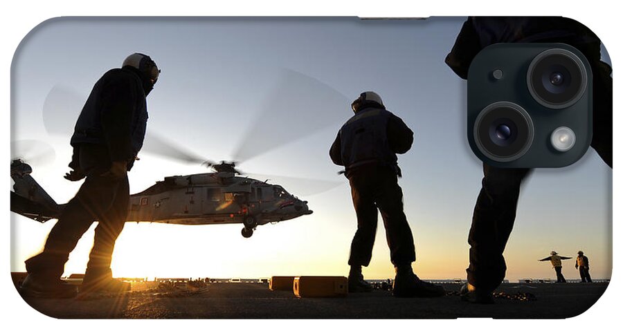 Military iPhone Case featuring the photograph Sailors Watch A Helicopter Lift by Stocktrek Images