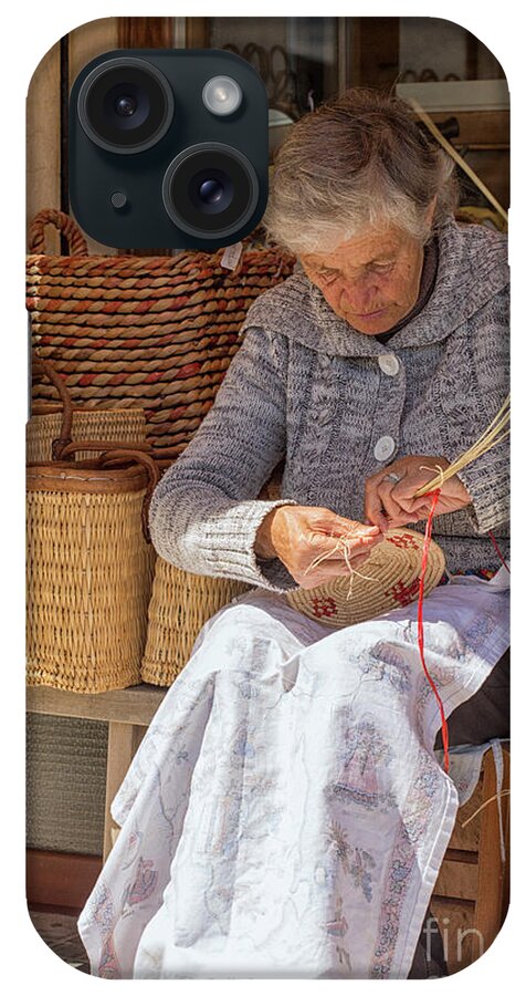 Adult iPhone Case featuring the photograph A woman weaving a basket in Castelsardo by Patricia Hofmeester