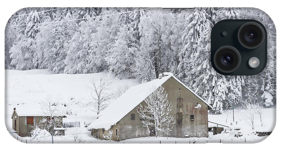 Snowy Landscape iPhone Case featuring the photograph An old farmhouse in the snow by Paul MAURICE
