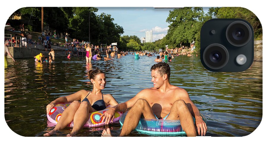 Barton Springs Pool iPhone Case featuring the photograph Attractive smiling couple floating on inner tube at Barton Sprin by Dan Herron