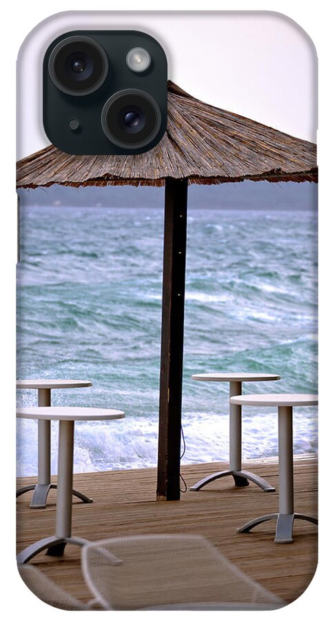 Beach iPhone Case featuring the photograph Beach bar parasol by rough sea by Brch Photography