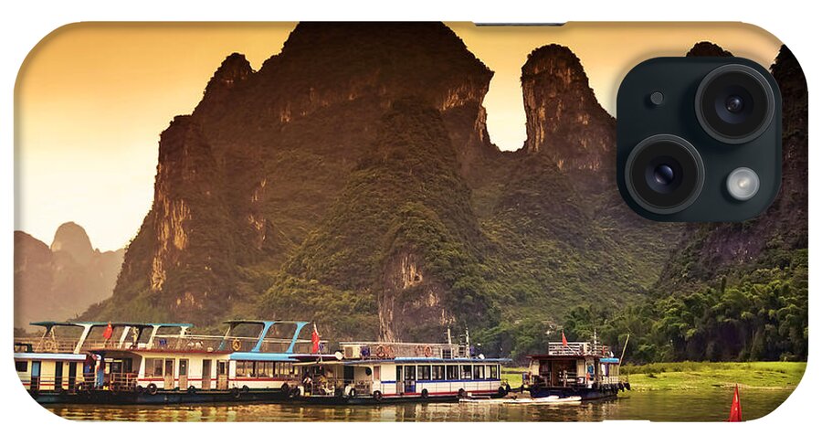Sunset iPhone Case featuring the photograph Boats by the river return-China Guilin scenery Lijiang River in Yangshuo by Artto Pan