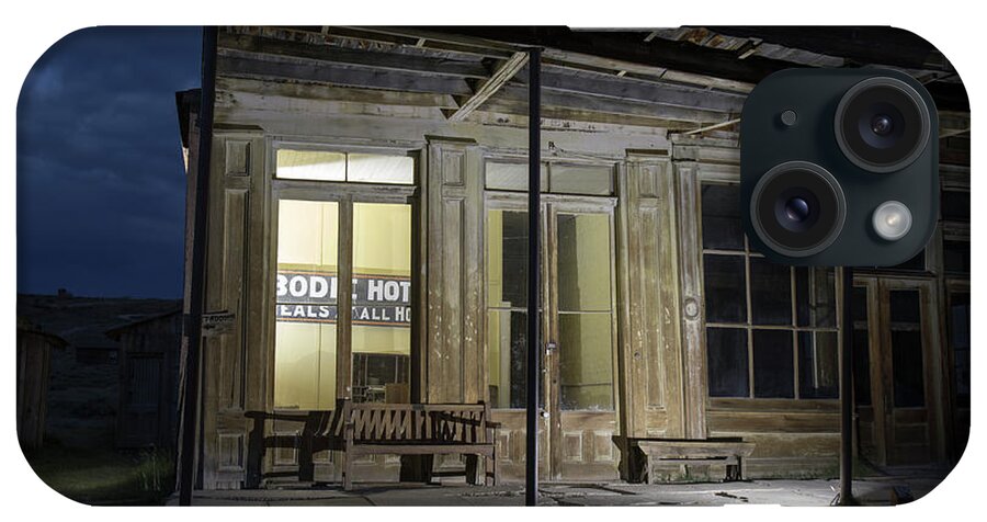Abandoned iPhone Case featuring the photograph Bodie Hotel illuminated at night by Karen Foley