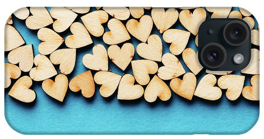 Love iPhone Case featuring the photograph Bunch of hearts on blue background. by Michal Bednarek