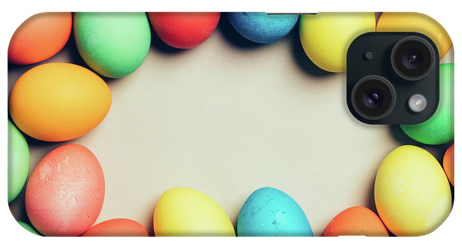 Egg iPhone Case featuring the photograph Bunch of home-dyed eggs. Copyspace. by Michal Bednarek