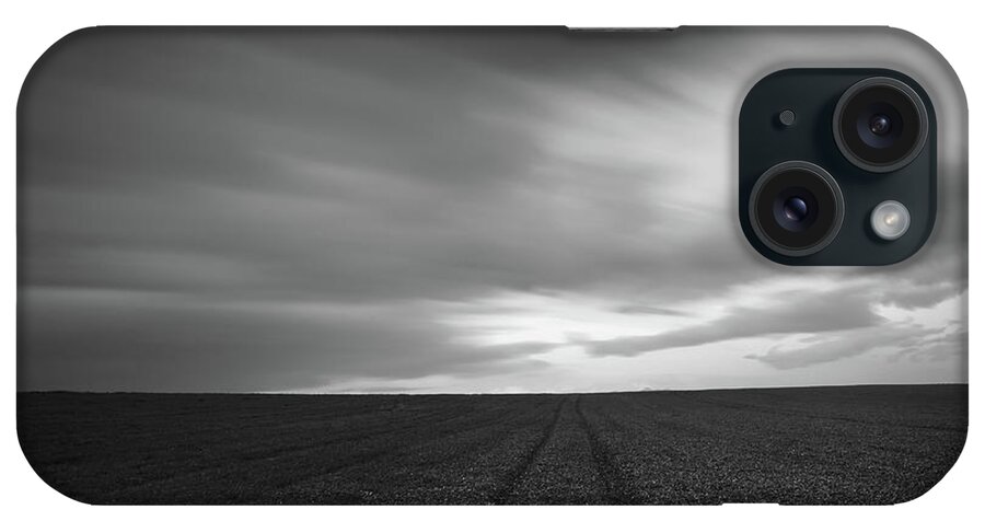 Field iPhone Case featuring the photograph Field and cloudy sky by Michalakis Ppalis