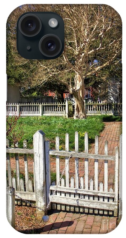 Garden Gate Colonial Williamsburg Virginia Tree Fence Blue Sky Spring Brick Path Ball And Chain Weighted Fence iPhone Case featuring the photograph Garden Gate Colonial Williamsburg Virginia II by Karen Jorstad