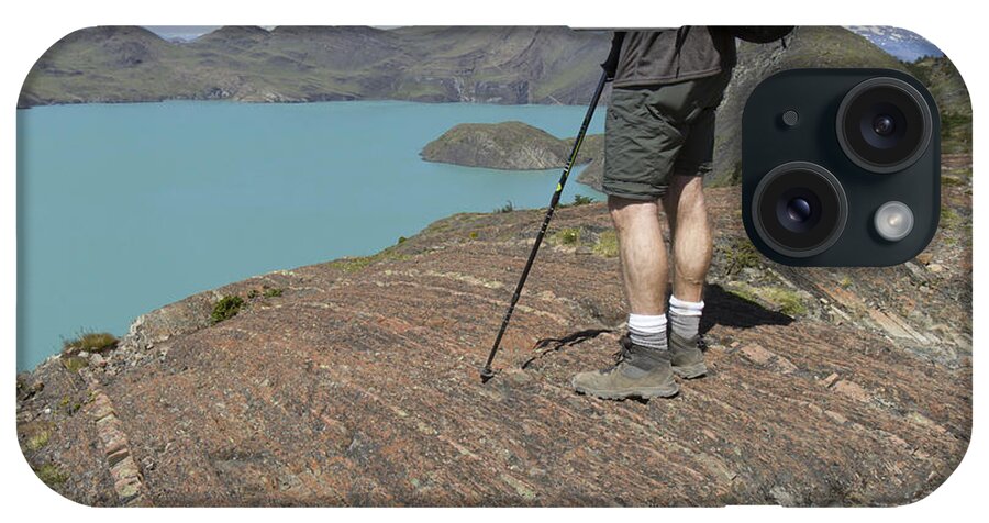 Adventure iPhone Case featuring the photograph Hiker overlooking Sapphire Lake in Torres del Paine, Chile by Karen Foley
