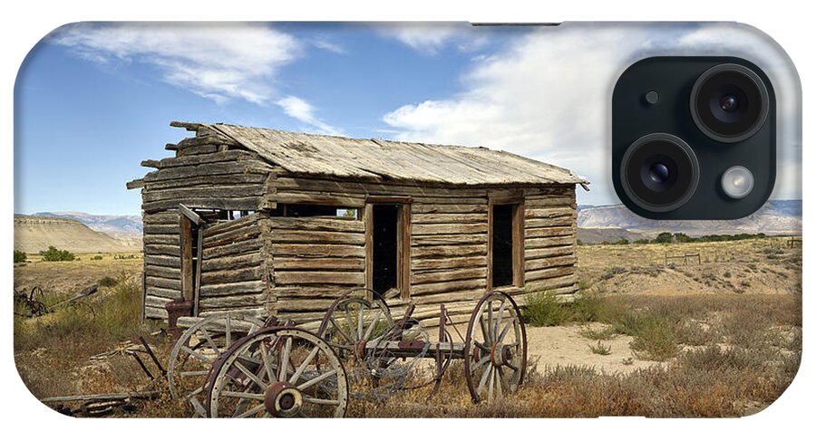 Carol M. Highsmith iPhone Case featuring the photograph Historic cabin and buckboard wheels in Big Horn County in Wyoming by Carol M Highsmith