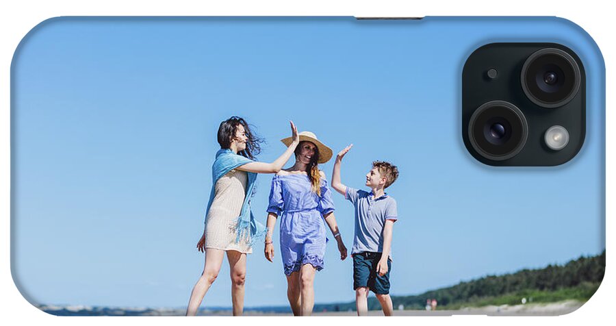 Family iPhone Case featuring the photograph Mother with children walking by the sea by Michal Bednarek