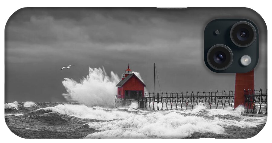 Lighthouse iPhone Case featuring the photograph November Storm with Flying Gull by the Grand Haven Lighthouse by Randall Nyhof