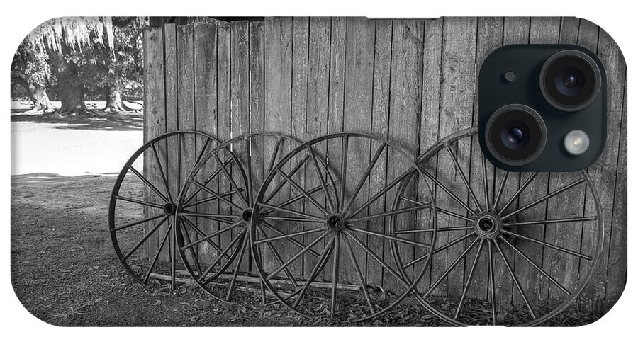 Black And White iPhone Case featuring the photograph Old Wagon Wheels Black And White by Kathy Baccari