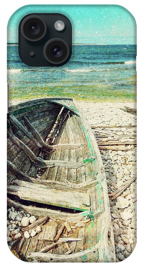 Ship iPhone Case featuring the photograph Old wooden boat on the seashore, retro image by GoodMood Art