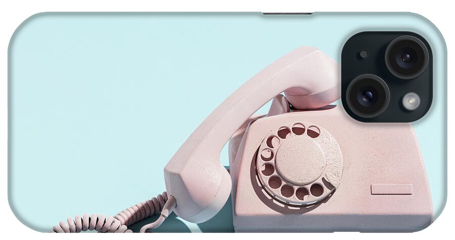 Call iPhone Case featuring the photograph Oldschool pink telephone on a blue background by Michal Bednarek