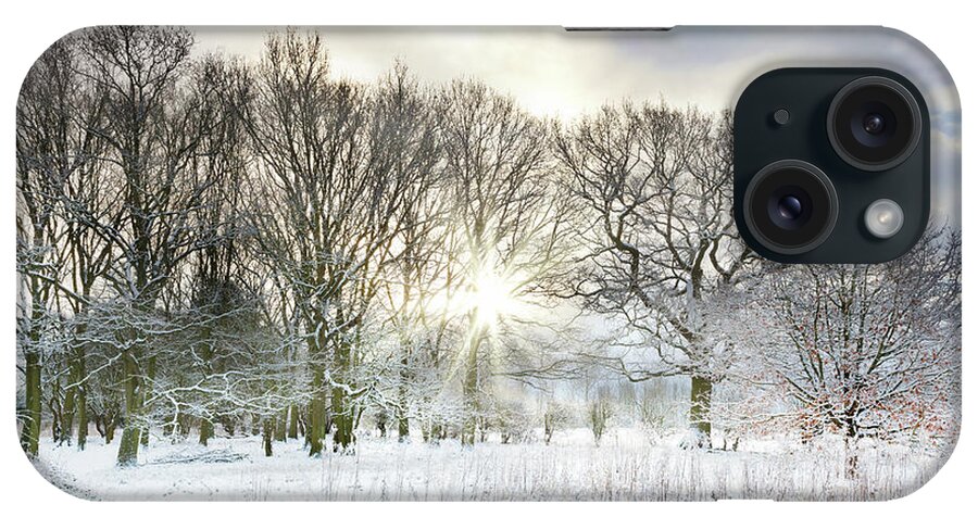 Snow iPhone Case featuring the photograph Snow covered rural trees with early morning sunrise by Simon Bratt