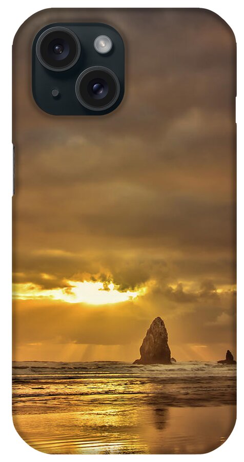 Cannon Beach iPhone Case featuring the photograph The Evening Glow by Don Schwartz