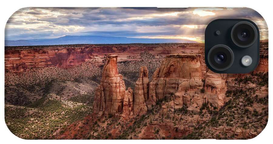 Colorado National Monument iPhone Case featuring the photograph The Sun coming up over the Colorado National Monument by Ronda Kimbrow