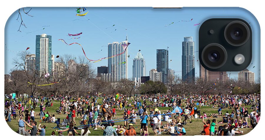 Zilker Park Kite Festival iPhone Case featuring the photograph The Zilker Park Kite Festival is Americas oldest continuous kite festival held every March in downtown Austin Texas by Dan Herron