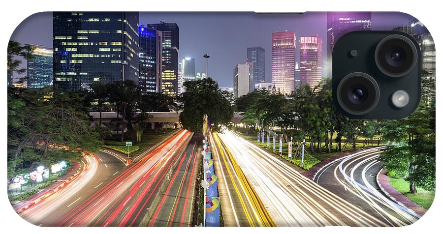 Capital Cities iPhone Case featuring the photograph Traffic night rush in Jakarta, Indonesia capital city. by Didier Marti