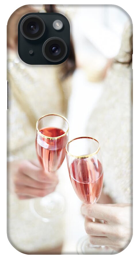 Caucasian iPhone Case featuring the photograph Two Giggling Ladies Toasting Champagne by Gillham Studios